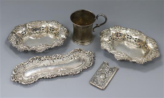 A pair of silver bonbon disher, a silver pin tray, a Victorian silver christening mug and a silver card case.